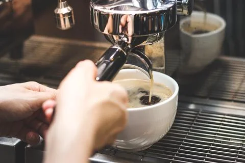 Close up of Extraction of coffee from the machine. Stock Photos