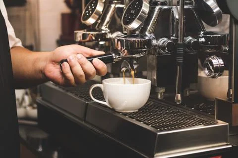 Close up of Extraction of coffee from the machine. Service concept of Barista Stock Photos