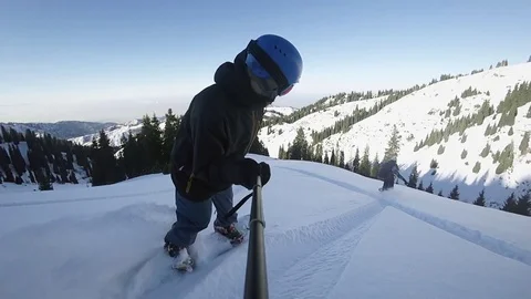 Close up of extreme snowboarders riding by powder by GoPro Stock Footage