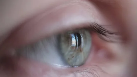 Close up of eye blinking. Opening and closing eye macro shot. Stock Footage 147194612