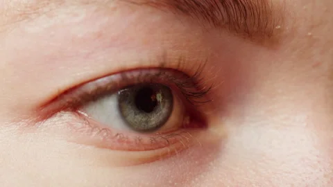 Close-up of a eye blinking, opening and closing, fire reflection in eye Stock Footage 167293483