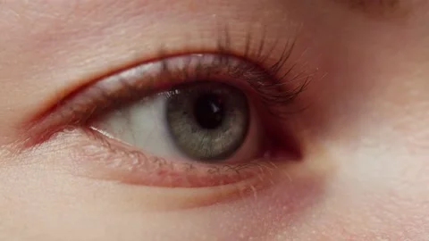 Close-up of a eye blinking, opening and closing. Advertising of everyday contact Stock Footage 221939842