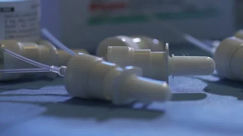 Close on eye dropper bottle lids in lab Stock Footage 20447271