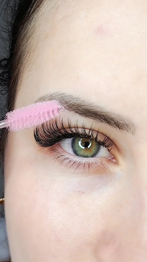 Close up of eye with eyelash Extensions in beauty salon macro view Stock Footage 246229630
