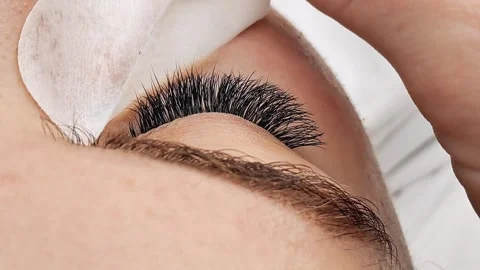 Close up of eye with eyelash extensions ,beauty salon treatment ,2d volume Stock Footage 304612290