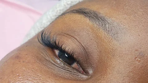 Close up of eye with eyelash extensions ,beauty salon treatment ,2d volume, 3d v Stock Footage 317742910