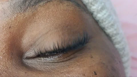 Close up of eye with eyelash extensions ,beauty salon treatment ,2d volume, 3d v Stock Footage 317742914