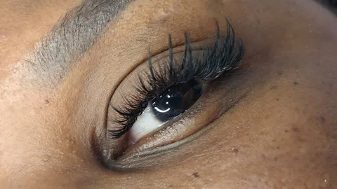 Close up of eye with eyelash extensions ,beauty salon treatment ,2d volume, 3d v Stock Footage 317873922