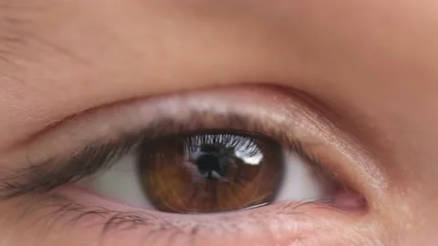 Close up of Eye of Kid Blinking. Macro Video stock 136613154