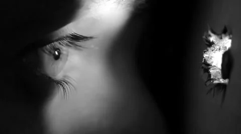 Close Up Eye Spying through Hole HD Stock Footage 34332522
