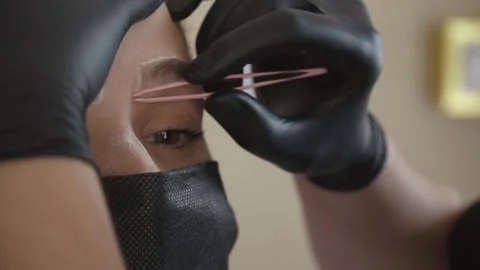 Close Up of Eyebrow Mapping with Thin Thread Stock-Footage 346543358