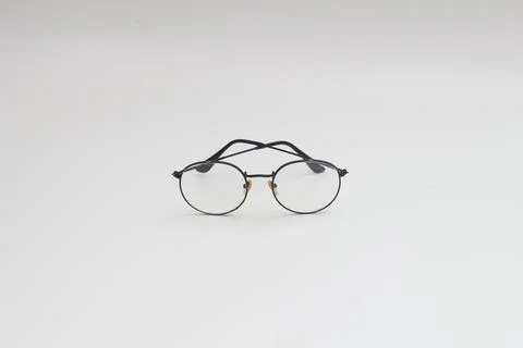 A close up of eyeglasses with black frames isolated on white background Stock Photos
