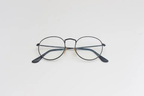 A close up of eyeglasses with black frames isolated on white background Stock Photos