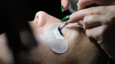 Close-up of eyelash extension procedure. Stock Footage 263970318