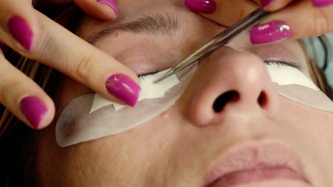 Close-up of the eyelash extension process. Stock Footage 164585171