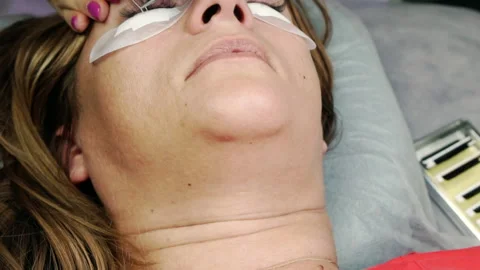 Close-up of the eyelash extension process. Stock Footage 170351618