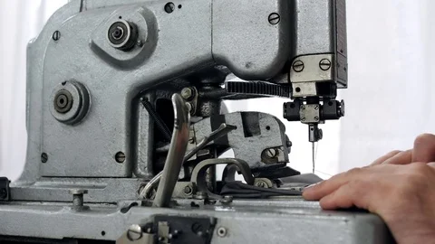 Close-up. Eyelet buttonhole machine in work. Stock Footage 80755536