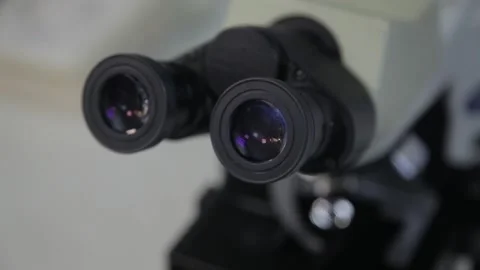 Close-up. eyepiece of a powerful microscope, in a laboratory. Stock Footage 132251664