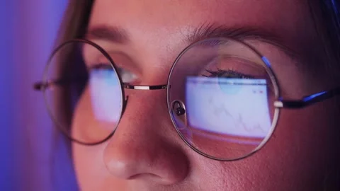 Close-up of eyes with glasses. Reflection of Web pages in the lenses of glasses Stock Footage 316215489