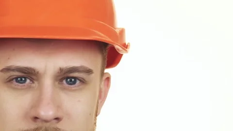 Close up of the eyes of a happy construction worker wearing hardhat Stock-Footage 311946689