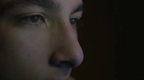 Close-up of eyes looking at the tablet in the dark Stock Footage 58960674