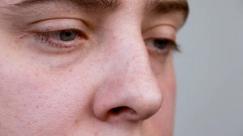 Close-up of the eyes of a man reading a book. Pupils move side to side as a man  Stock-Footage 123075445