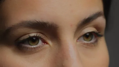 Close-up of eyes . Rapid eye movement. The fleeing gaze of the girl behind the Stock Footage 270404142