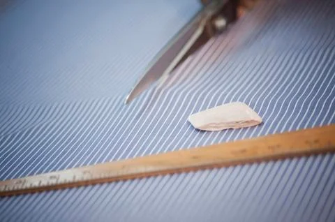 Close-up of a fabric being cut by scissors 스톡 사진