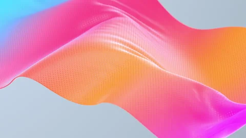 Close up. fabric  rainbow gradient, on a gray background fluttering in the wind. Stock Footage 136571104