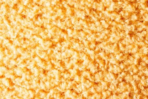 Close-up fabric texture. Fancy curls of colored fabric fibers. Stock Photos