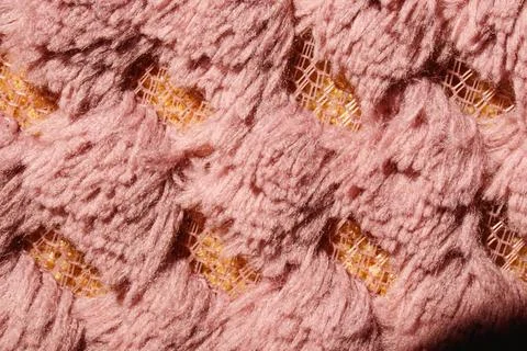 Close-up fabric texture. Fancy curls of colored fabric fibers. Stock Photos