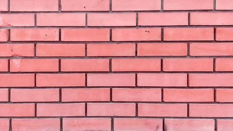 Close-up of the facade of a modern yellow brick building with a b.. Stock Photos