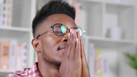 Close up face African man with glasses sitting and taking a rest Stock-Footage 167468645