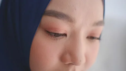 Close up face and eye of beautiful muslim woman with white background Stock Footage 133449239