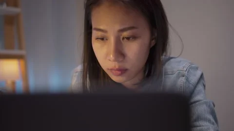 Close up face asia female looking at computer notebook Stock Footage 157444052