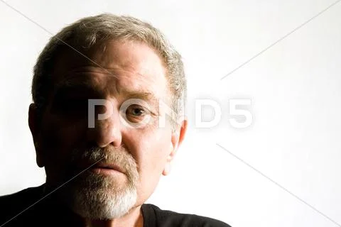 Close up on the face of a baby boomer - isolated Stock Photos