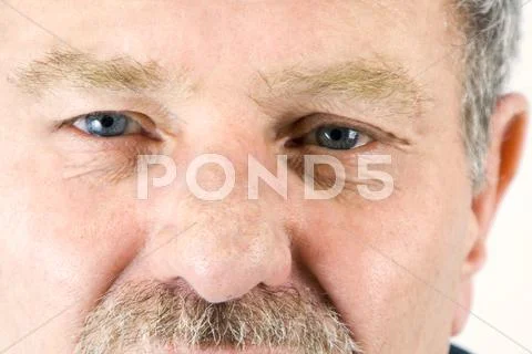 Close up on the face of a baby boomer Stock Photos