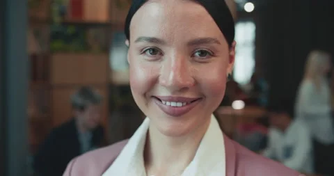 Close-up face of beautiful professional 30s female mixed race company manager Stock Footage 185675504