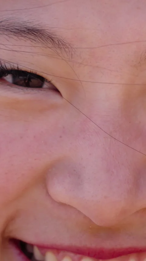Close up of face beautiful young Asian girl posing smiling with gap teeth Stock Footage 274492444