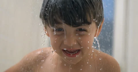 Close-up face of child face in shower bath in super slow-motion 800 fps smi.. Stock Footage 250229975