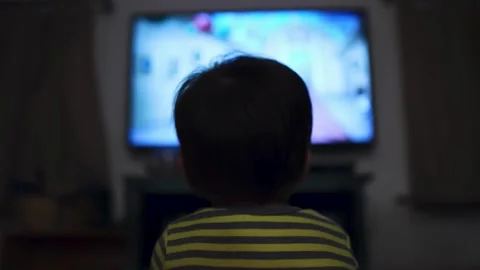 Close-up Face of Child While Person Watching TV. Stock Footage 278017442