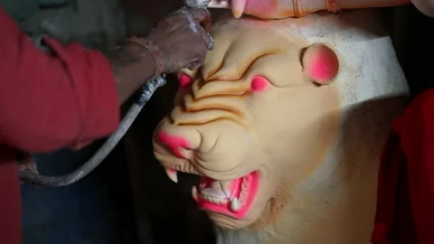 Close up face of a clay idol of Goddess Devi Durga Stock Footage 229726954
