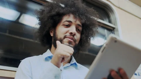 Close-up Face of Confident and Successful Male Student Using Mobile Computer or Stock Footage 136069730