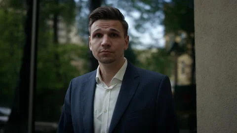 Close up face of cool trendy man looking at camera. Portrait of a handsome Video stock 131629333