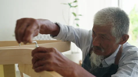 Close-up face of elderly Asian man with hair grey assembled chair Stock Footage 238650872
