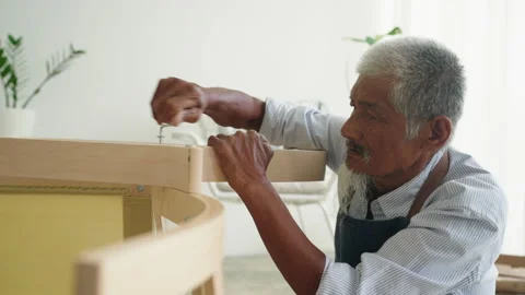 Close-up face of elderly Asian man with hair grey assembled chair Stock Footage 238650900