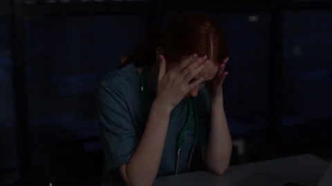 Close-up face of frustrated desperate young female doctor crying thinking about Video stock 153918603