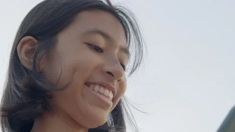 Close up of face girl using mobile phone happy and smile outdoor Stock Footage 137016889