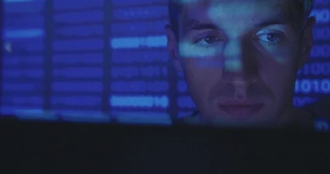 Close up face of Hacker programmer is working on computer writing the code in Video stock 95923286