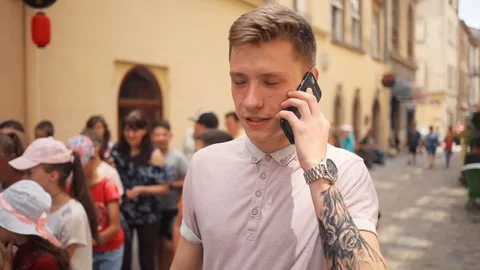 Close up face handsome young man speak on phone walk smile happy on street Stock Footage 92418165